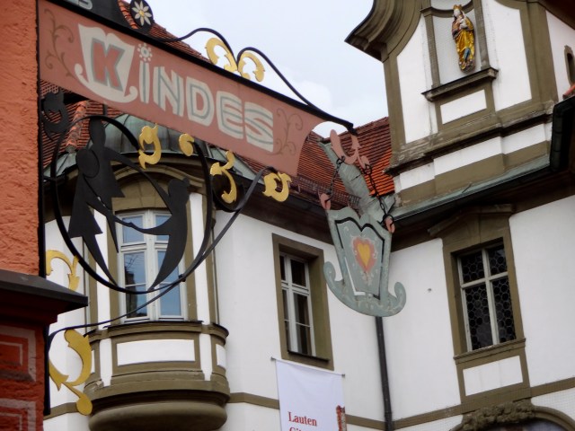 These wrought iron signs seem to be typical, too.