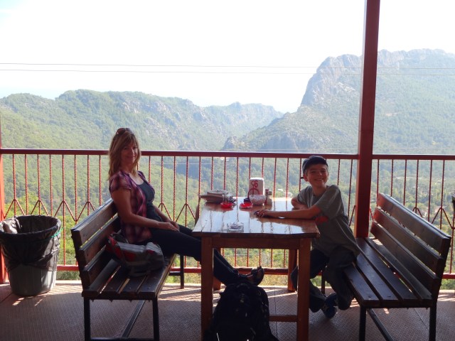 Tea and snacks available while you wait. Lots of vans pull up to drop passengers heading to Olympos.